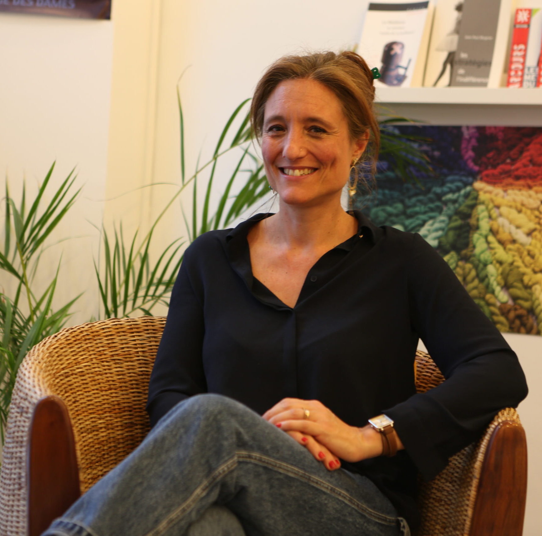 a woman in a tan jacket and tan pants